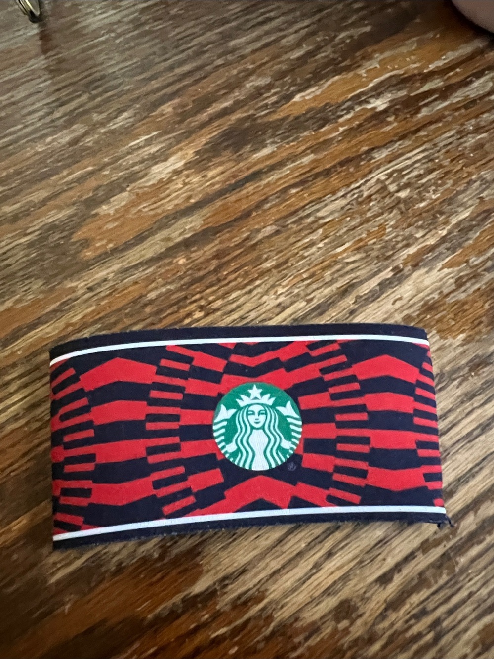 Starbucks Red and Black Patterned Cup Sleeve with Green Logo